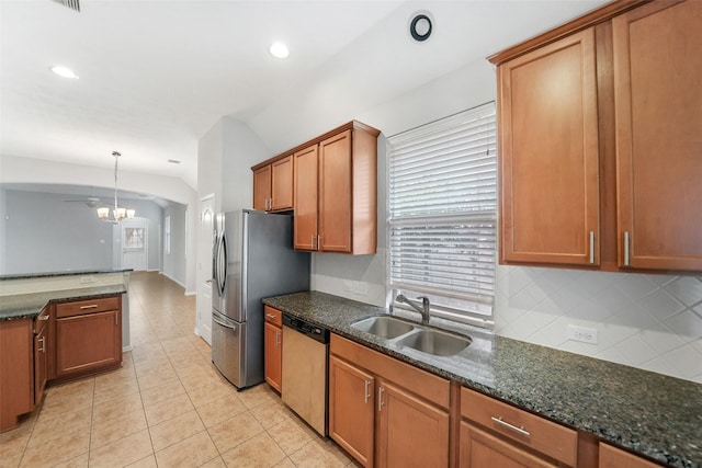 24510 Foxberry Glen Ln, Katy, TX 77494 - kitchen with brown cabinetry, a sink, recessed lighting, and appliances with stainless steel finishes