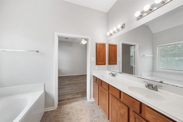 24510 Foxberry Glen Ln, Katy, TX 77494 - bathroom featuring a bath, tile patterned floors, a sink, and double vanity