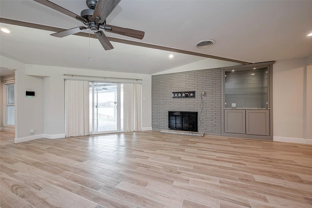 414 Lakeview Dr, Sugar Land, TX 77498 - unfurnished living room with light wood finished floors, a fireplace, baseboards, and vaulted ceiling
