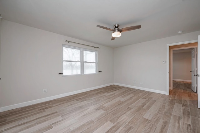 unfurnished room with light wood-style flooring, baseboards, and ceiling fan