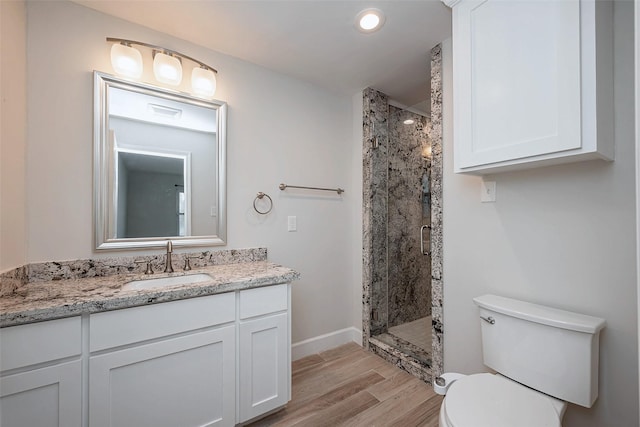 414 Lakeview Dr, Sugar Land, TX 77498 - full bathroom featuring a stall shower, vanity, toilet, and wood finished floors