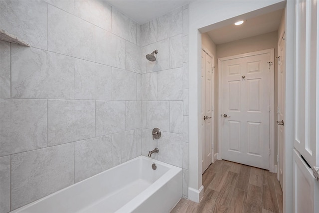 full bathroom featuring tub / shower combination and wood finished floors