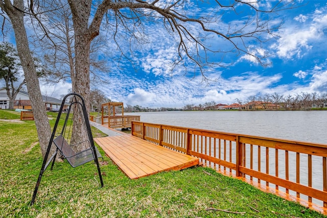 view of dock featuring a lawn and a deck with water view