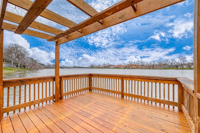 wooden deck featuring a water view