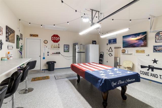 playroom featuring a garage and speckled floor