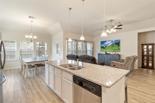 kitchen featuring visible vents, open floor plan, appliances with stainless steel finishes, and a sink