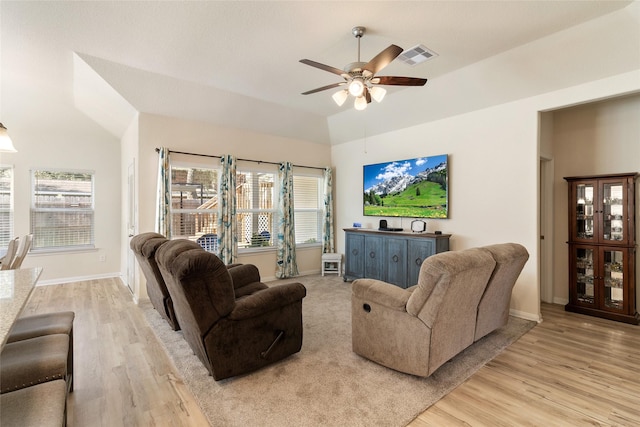 living area with visible vents, ceiling fan, baseboards, and light wood-style floors