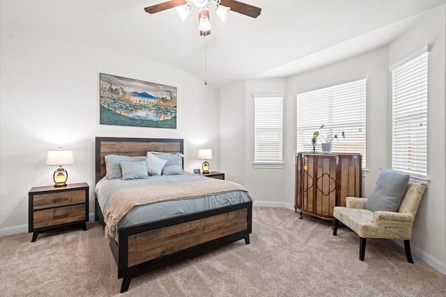 bedroom featuring a ceiling fan, carpet, lofted ceiling, and baseboards