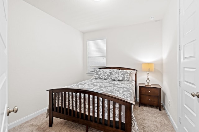 bedroom featuring carpet floors and baseboards