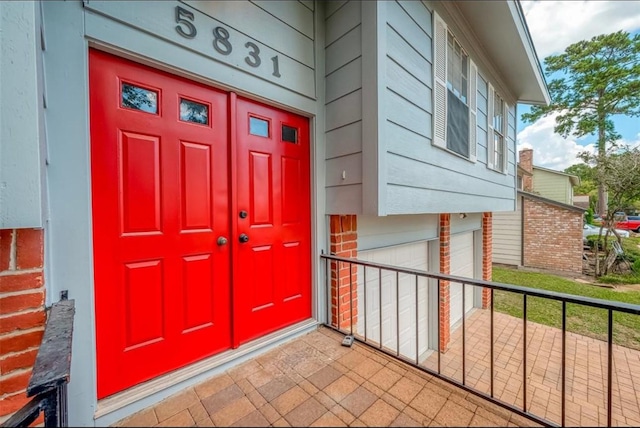 entrance to property with brick siding