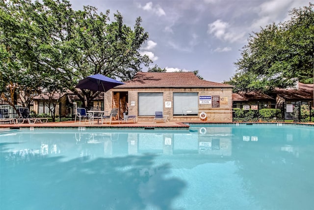 view of pool with fence