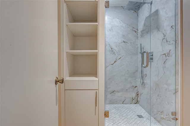 full bathroom with a marble finish shower