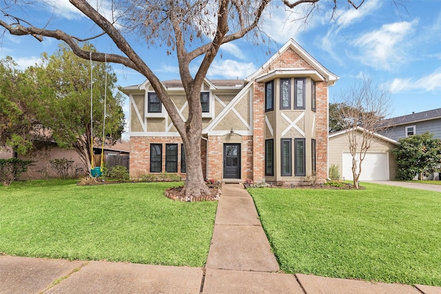 english style home featuring a garage, concrete driveway, brick siding, and a front lawn