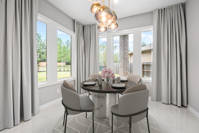 dining area featuring baseboards