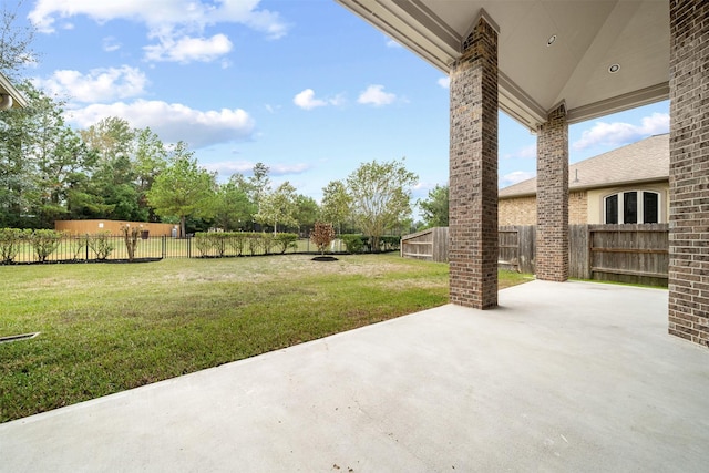 view of yard with a patio area and a fenced backyard