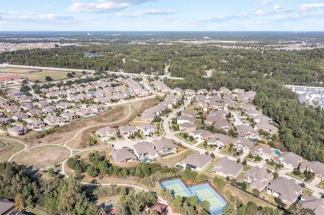 bird's eye view featuring a residential view and a view of trees