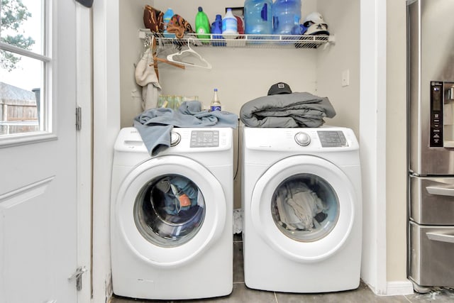 laundry room featuring washing machine and dryer and laundry area