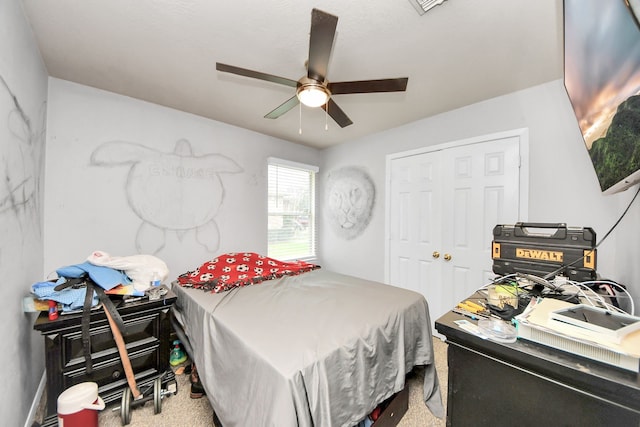 carpeted bedroom featuring ceiling fan