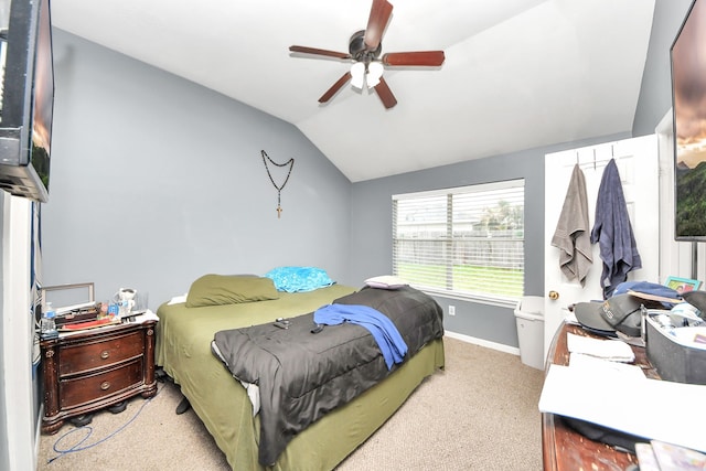 bedroom with vaulted ceiling, ceiling fan, baseboards, and light colored carpet