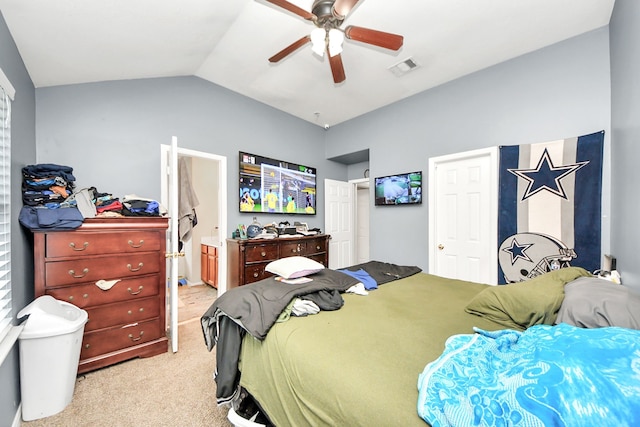 bedroom with lofted ceiling, connected bathroom, light colored carpet, a ceiling fan, and visible vents