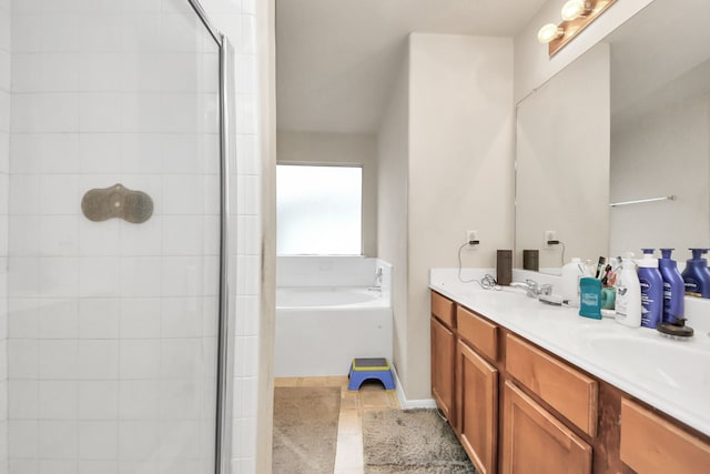 full bathroom featuring double vanity, tile patterned flooring, a sink, and a bath