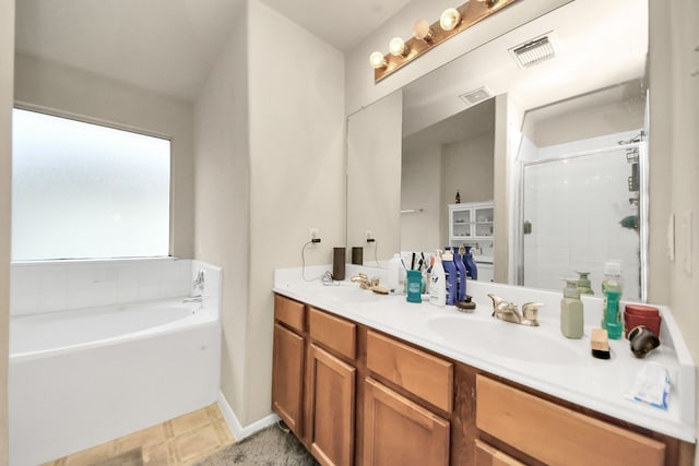 full bath with a garden tub, a sink, visible vents, double vanity, and a stall shower