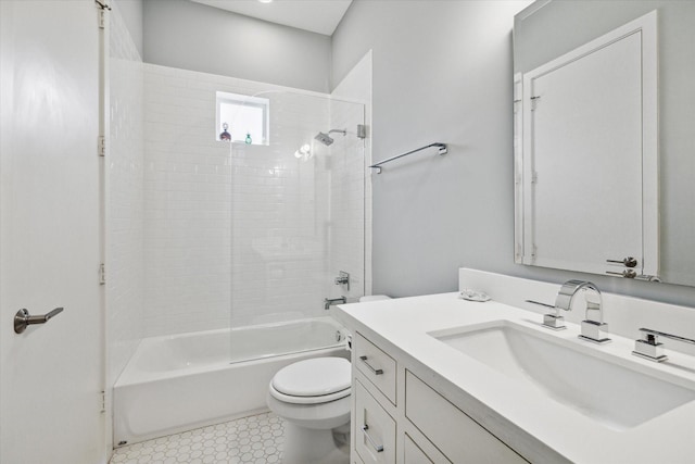 bathroom with toilet, tile patterned flooring, tub / shower combination, and vanity