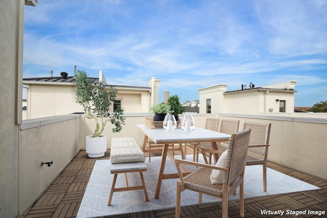 view of patio / terrace with outdoor dining area and a balcony