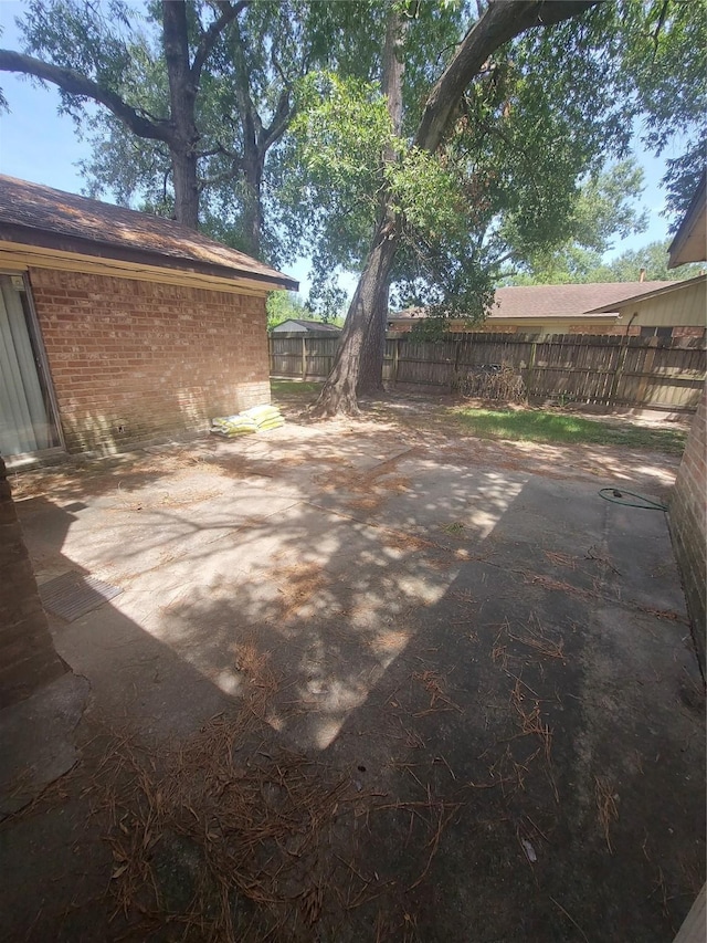 view of patio featuring fence