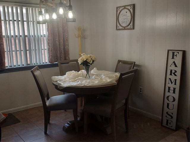 tiled dining room with baseboards