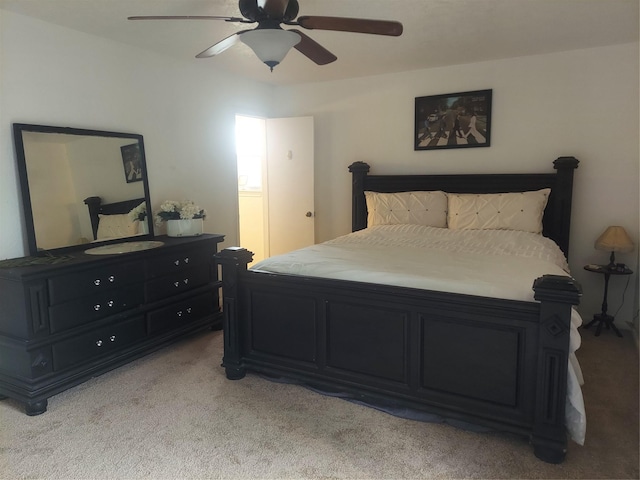 bedroom with light carpet and a ceiling fan