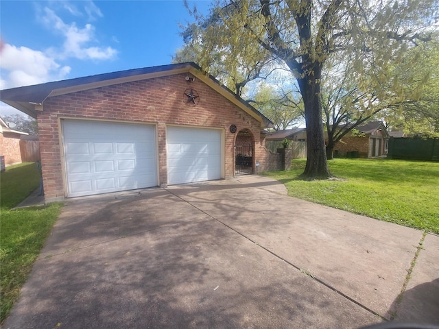 exterior space with concrete driveway and fence