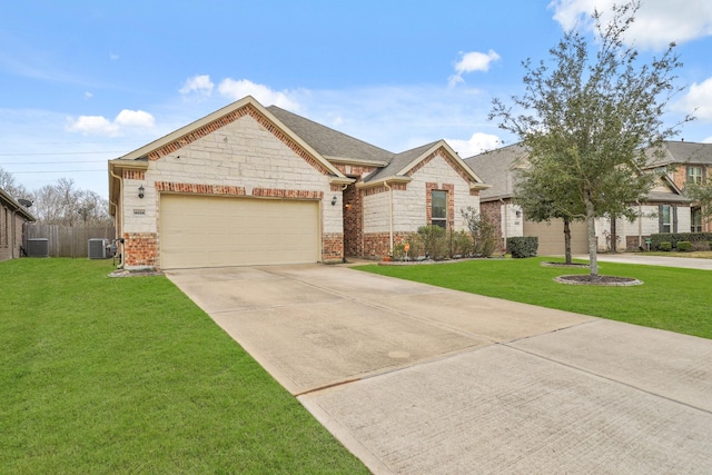 view of front facade with a garage, concrete driveway, central AC, and a front yard