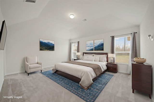 bedroom featuring baseboards, visible vents, and light colored carpet