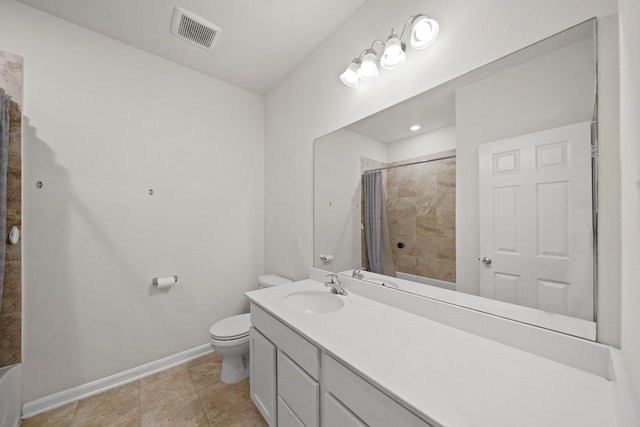 bathroom featuring visible vents, toilet, vanity, baseboards, and tile patterned floors