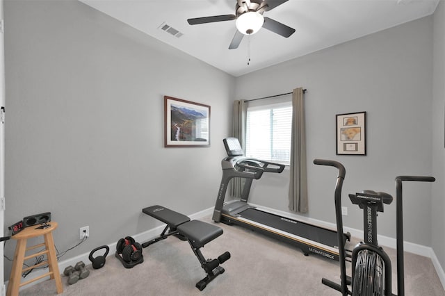 exercise area featuring a ceiling fan, visible vents, and baseboards