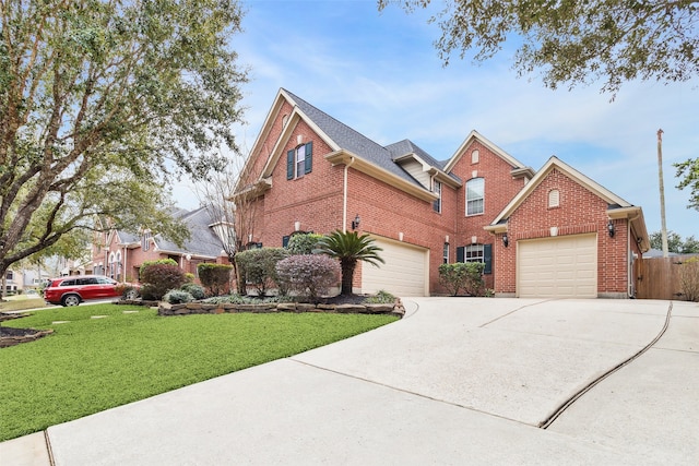 view of front of house with fence, concrete driveway, a front yard, a garage, and brick siding