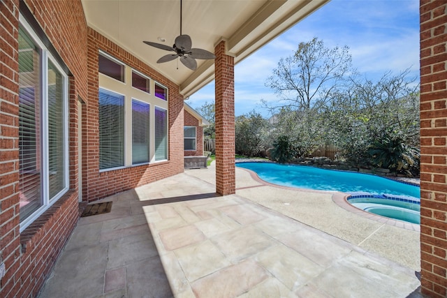 outdoor pool featuring a patio area, an in ground hot tub, ceiling fan, and fence