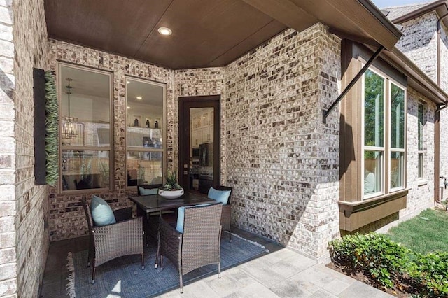 view of patio featuring outdoor dining area