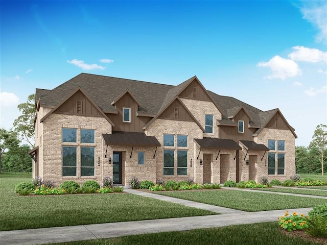 craftsman inspired home with a shingled roof, brick siding, board and batten siding, a front lawn, and a standing seam roof