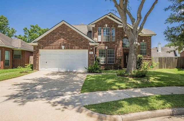 traditional-style home featuring a garage, driveway, fence, a front lawn, and brick siding