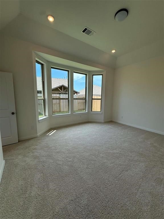 27015 Aurora Garden Ln, Katy, TX 77493 - unfurnished room with healthy amount of natural light, baseboards, light colored carpet, and recessed lighting