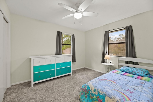 bedroom featuring carpet floors, baseboards, and a ceiling fan