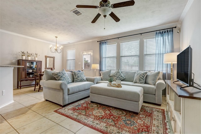 living room featuring light tile patterned floors, ornamental molding, a textured ceiling, and visible vents