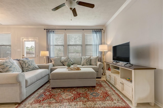 living area featuring ornamental molding and a ceiling fan