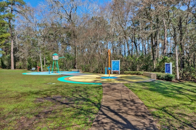 community jungle gym with a yard