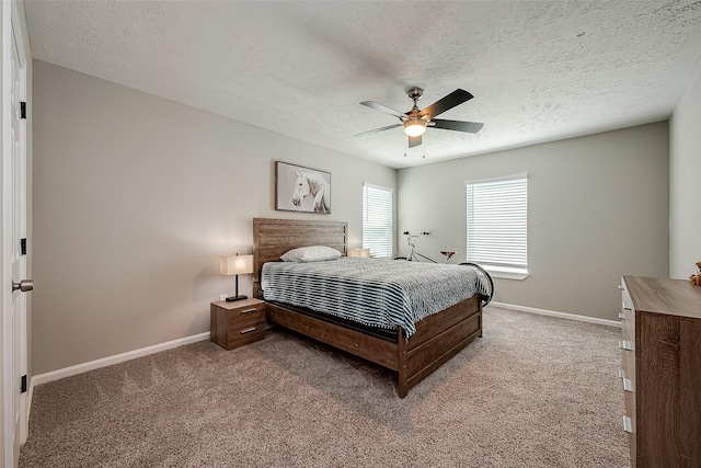 bedroom with carpet, a ceiling fan, and baseboards