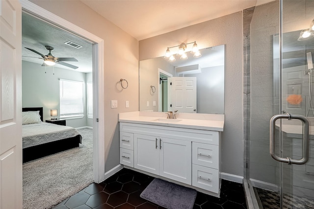 ensuite bathroom featuring visible vents, a ceiling fan, ensuite bath, tile patterned floors, and vanity