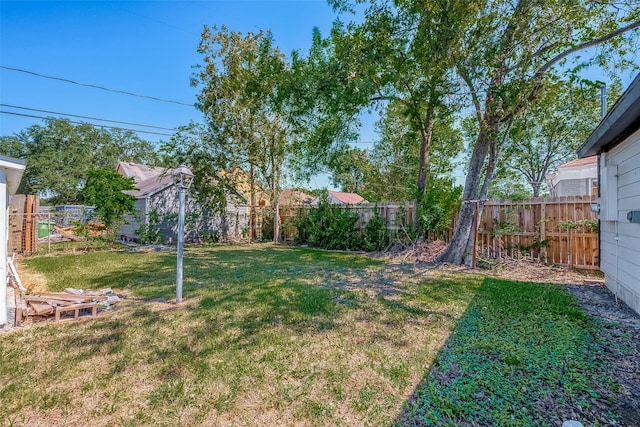 view of yard with a fenced backyard