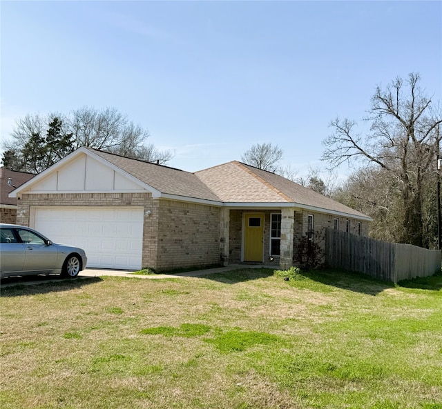 single story home with roof with shingles, brick siding, an attached garage, a front yard, and fence